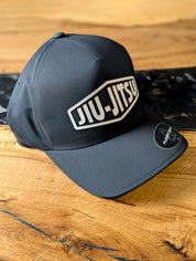 Black Jiu-Jitsu Logo Flexfit Hat – Premium BJJ Cap with Raised Rubberized Logo